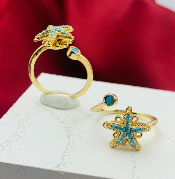 DIJE RODIO GIRATORIO ESTRELLA MAR CIRCON AZUL DORADO