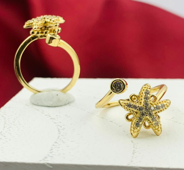 ANILLO RODIO GIRATORIOA ESTRELLA MAR CIRCON BLANCO DORADO