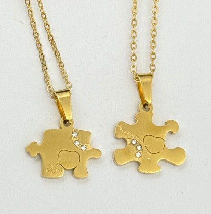 DUO ROMPECABEZA DORADO ACERO INOXIDABLE