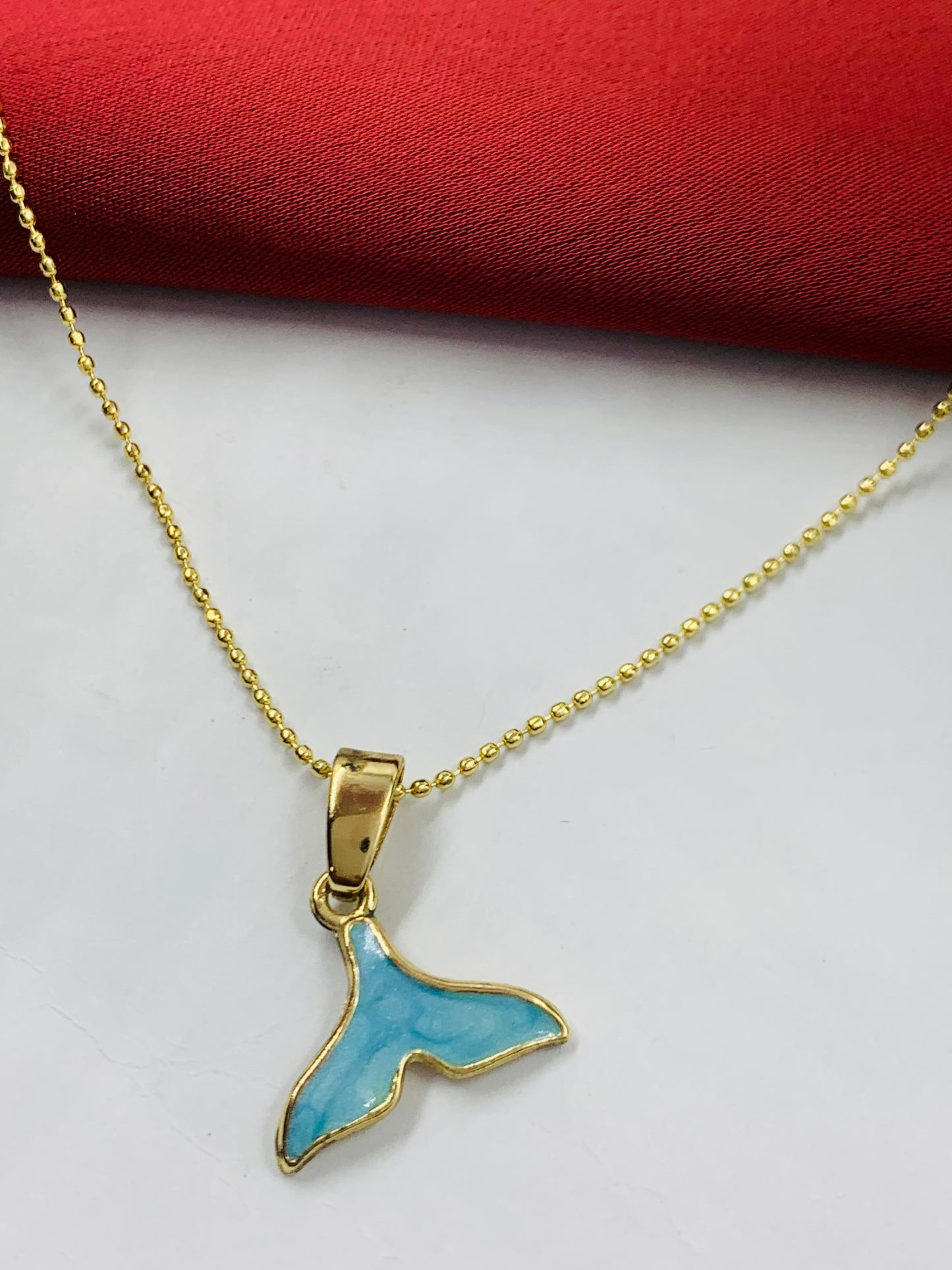 DUO RODIO COLA DELFIN DORADO