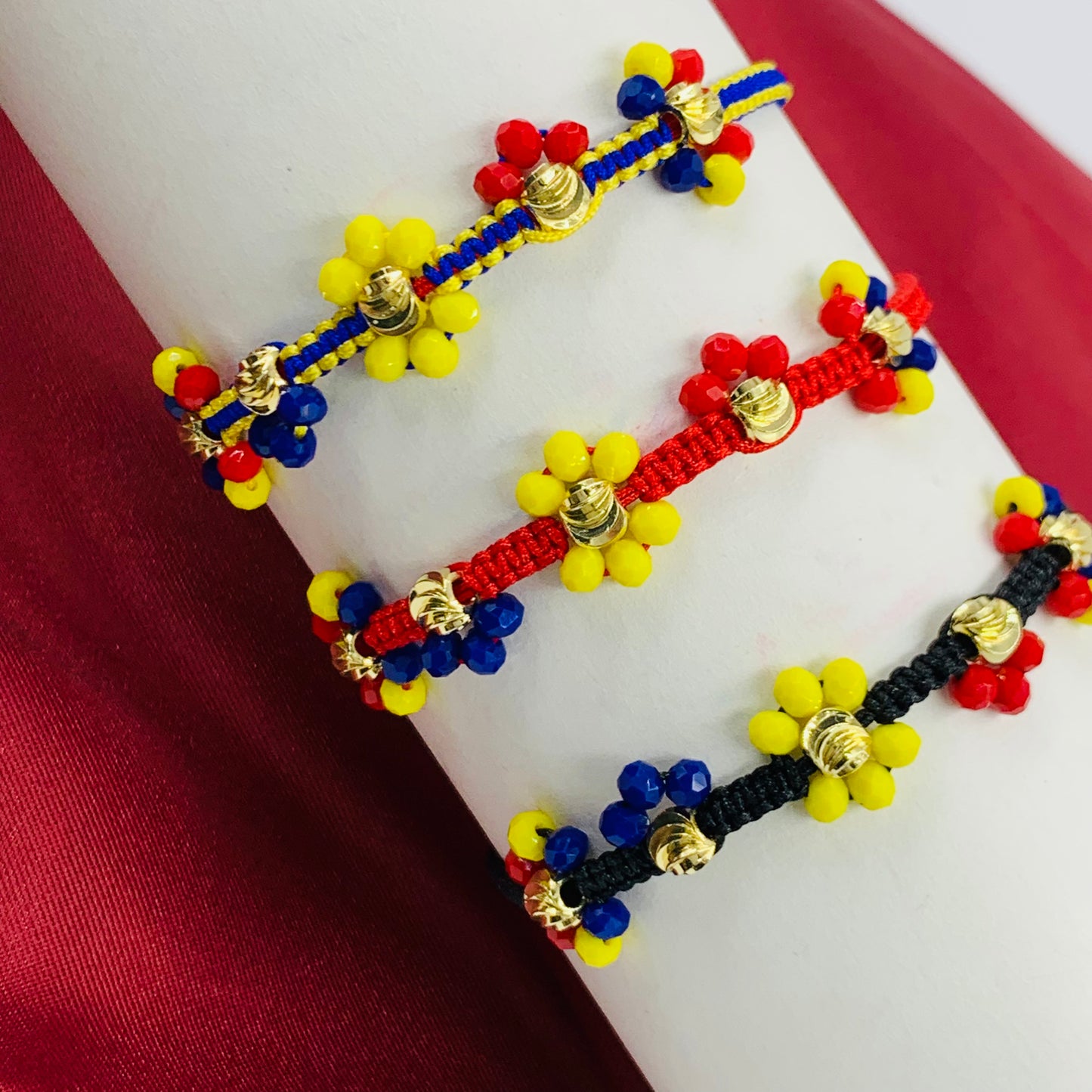 PULSERA TEJIDA RODIO BALIN DIAMANTADO FLOR TRICOLOR