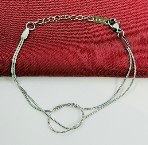 PULSERA ACERO INOXIDABLE NUDO AMOR PLATEADO