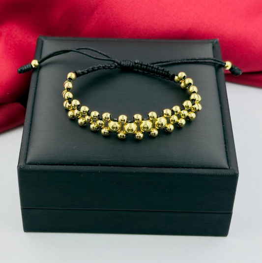 PULSERA ACERO INOXIDABLE DORADO 3 CARRILES HILO NEGRO