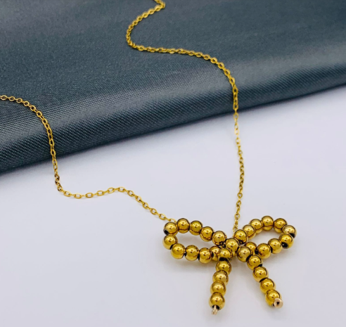 COLLAR MOÑO CIRCON DORADO