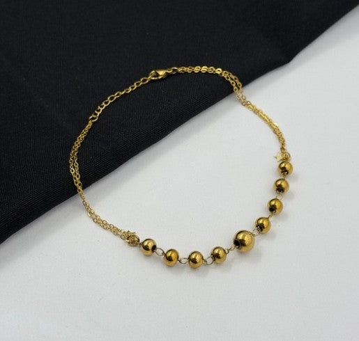 TOBILLERA BALINES ACERO DORADO