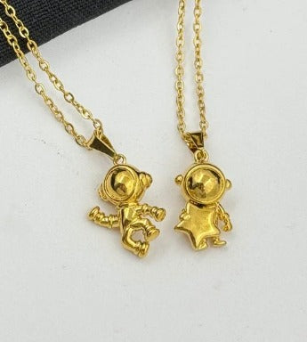 DUO ASTRONAUTAS DORADO ACERO INOXIDABLE