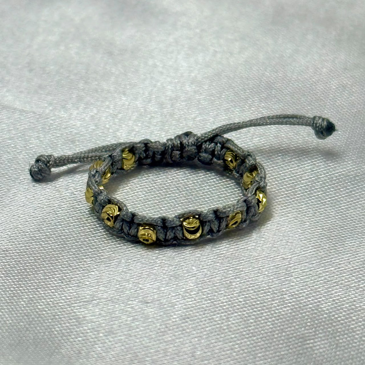 ANILLO RODIO TEJIDO GRIS DIAMANTADO DORADO