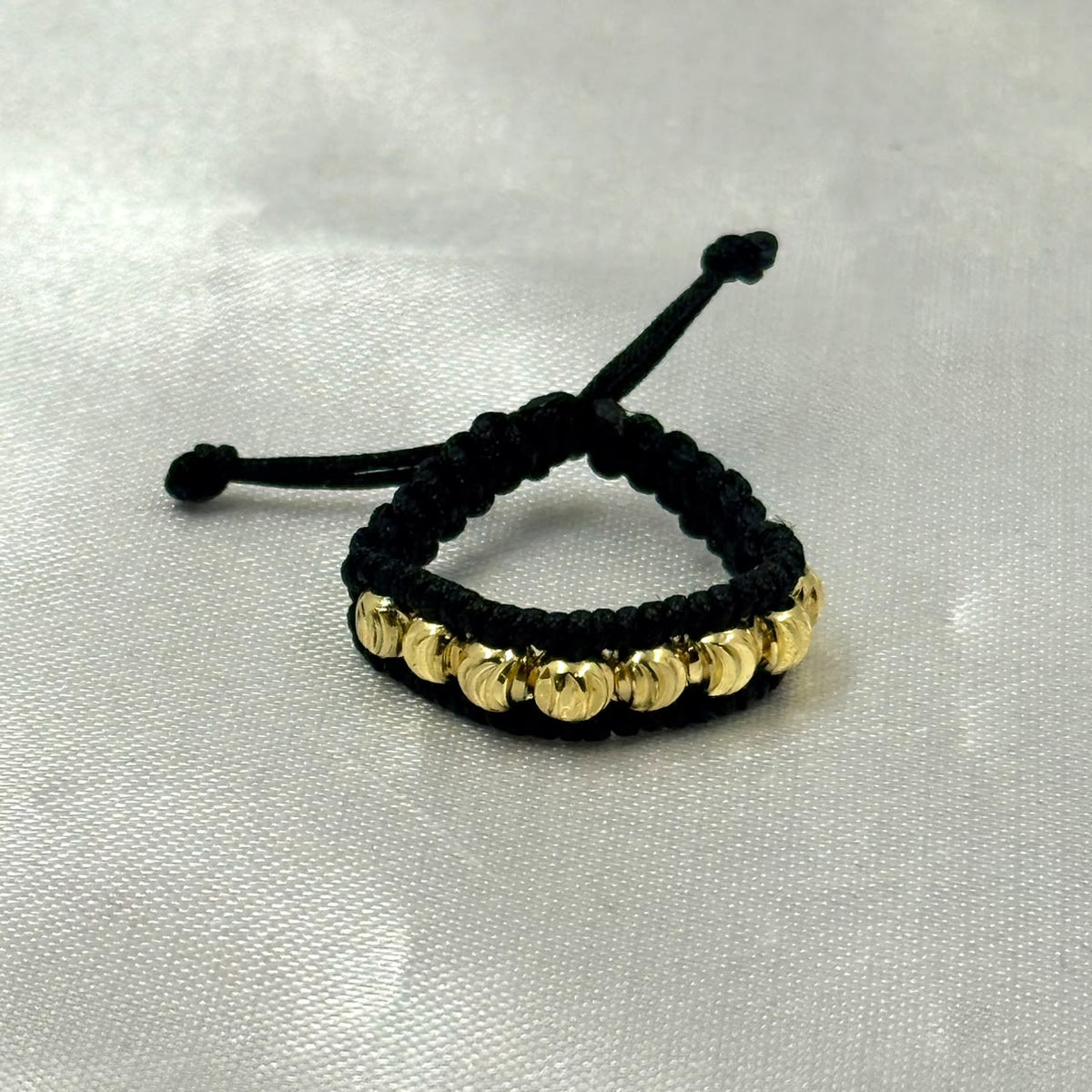 ANILLO RODIO TEJIDO NEGRO DIAMANTADO DORADO