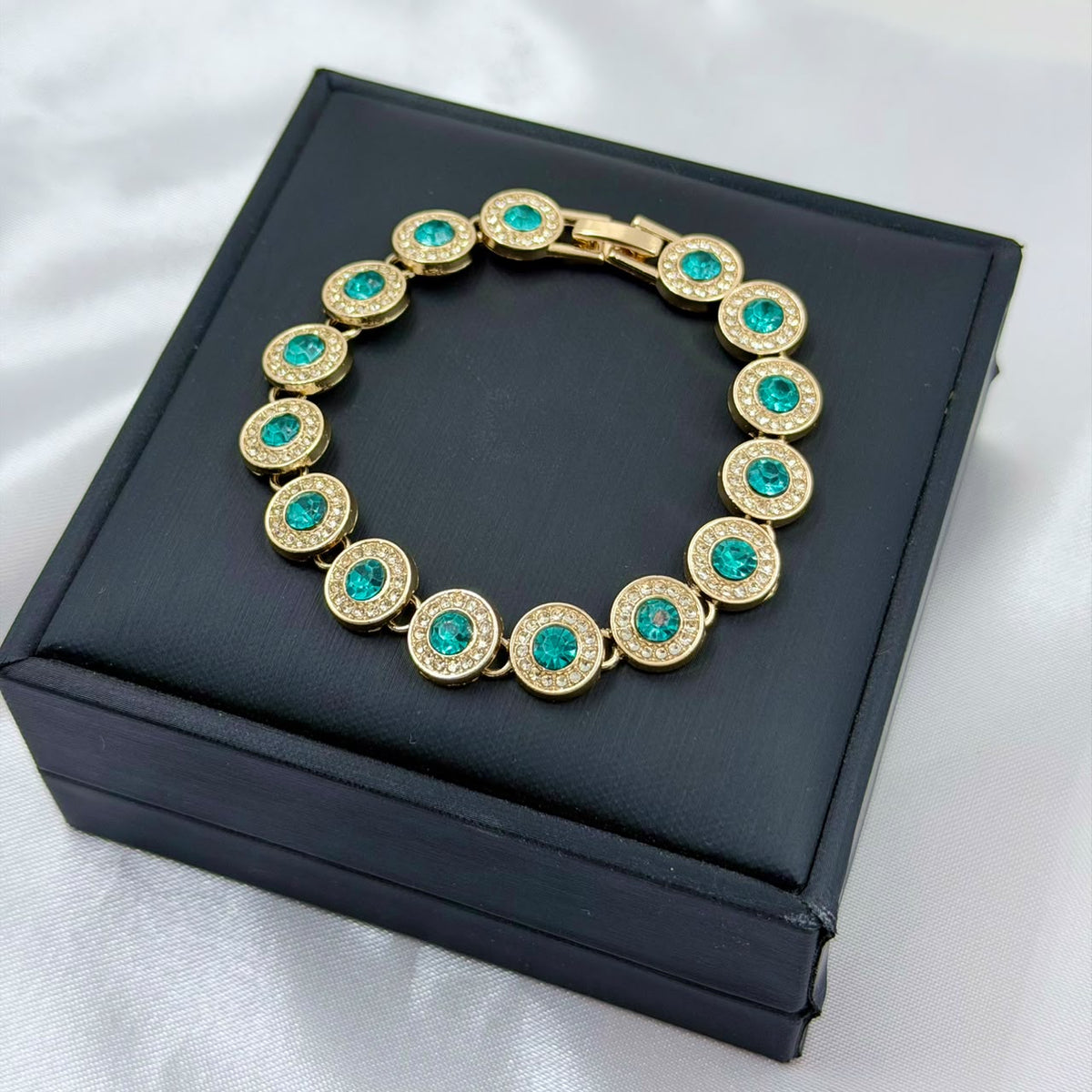 PULSERA RODIO AZUL CIRCON CENTRO REDONDO DORADO